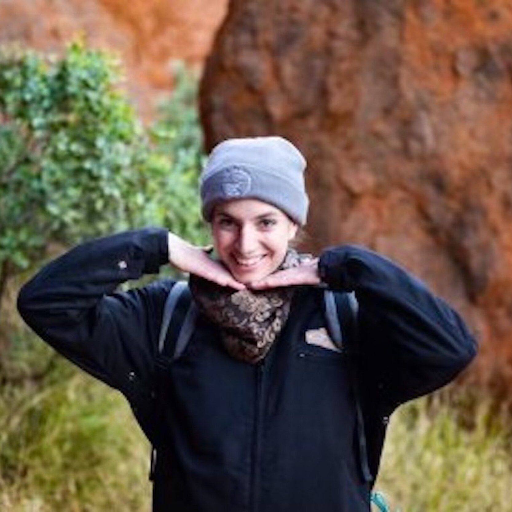 Tour Guide Tegan poses at Uluru